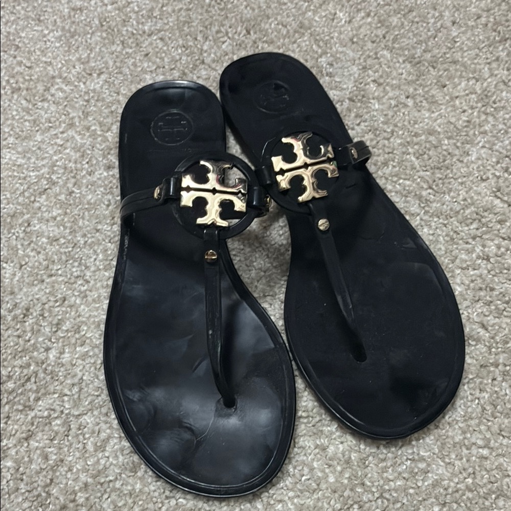 Tory Burch Black Flip Flops with Gold Emblem